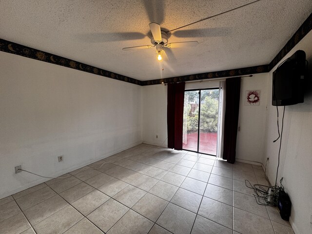 1101 Summit Place B Cir Unit B, West Palm Beach, FL 33415 - spare room featuring ceiling fan, light tile patterned flooring, and a textured ceiling