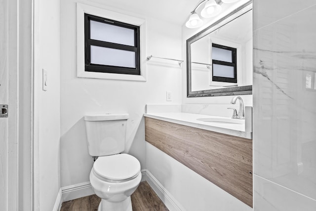 9676 Boca Gardens Pkwy Unit C, Boca Raton, FL 33496 - half bathroom featuring wood finished floors and vanity