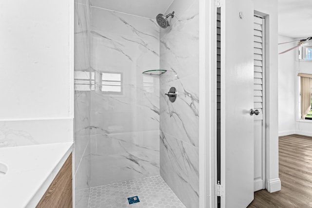 9676 Boca Gardens Pkwy Unit C, Boca Raton, FL 33496 - bathroom featuring a marble finish shower, vanity, and wood finished floors