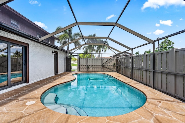 9676 Boca Gardens Pkwy Unit C, Boca Raton, FL 33496 - view of swimming pool with a patio area and glass enclosure