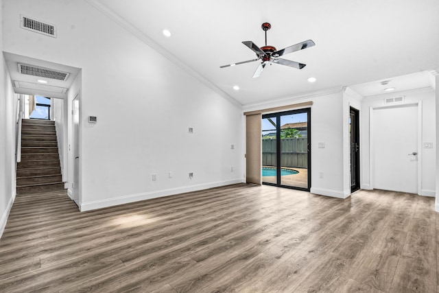 9676 Boca Gardens Pkwy Unit C, Boca Raton, FL 33496 - unfurnished living room featuring ornamental molding, wood finished floors, ceiling fan, recessed lighting, and stairway