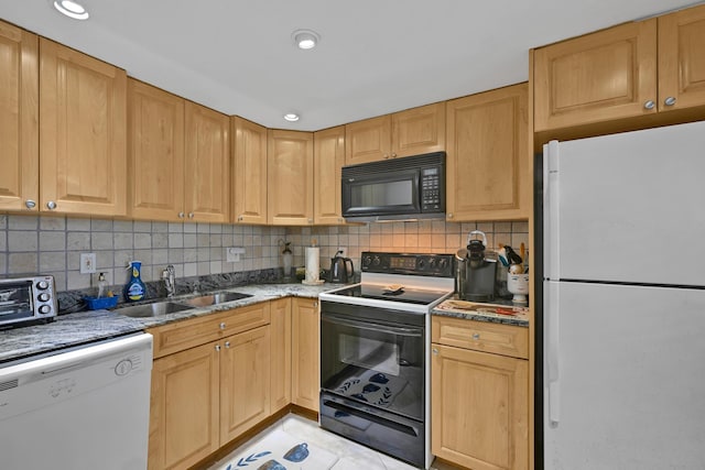 kitchen featuring decorative backsplash, a toaster, white appliances, light stone counters, and a sink