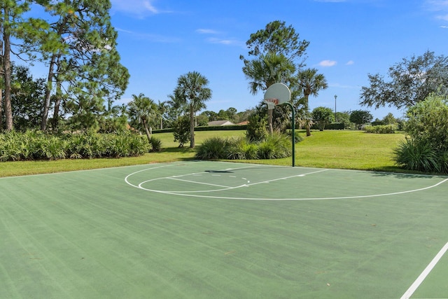 view of sport court featuring a lawn and community basketball court
