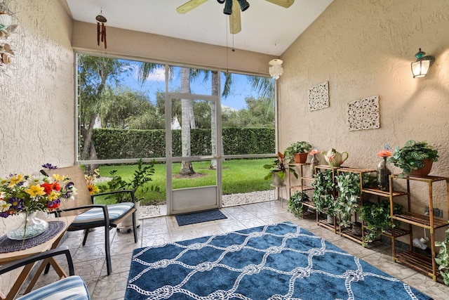 sunroom featuring a ceiling fan