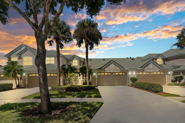 multi unit property with stucco siding and driveway