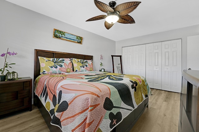 bedroom featuring wood finished floors, a closet, and ceiling fan