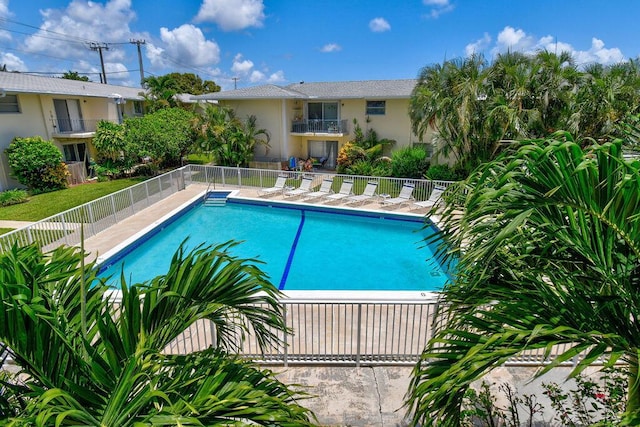 community pool featuring fence