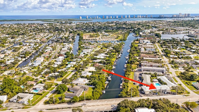 view of urban area featuring a nearby body of water and nearby suburban area