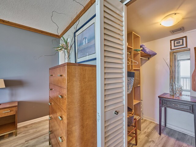 spacious closet with visible vents and wood finished floors