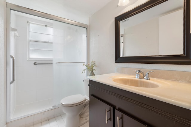 bathroom featuring vanity, tile patterned flooring, toilet, and a shower stall