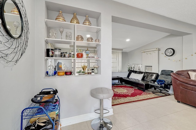 living area with tile patterned flooring, recessed lighting, and lofted ceiling