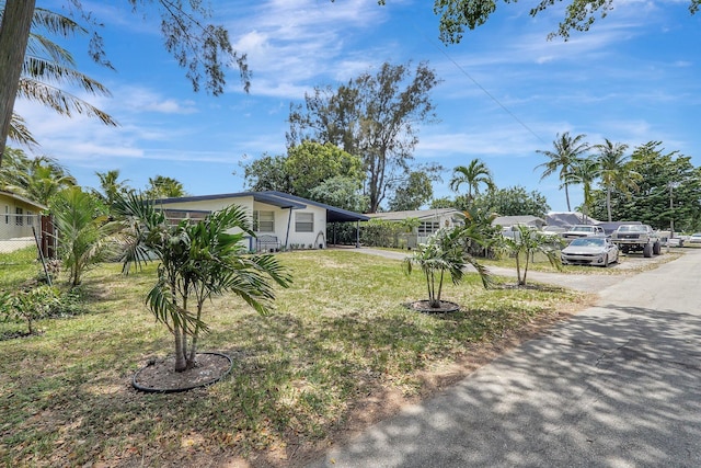 view of front of property with fence and a front yard