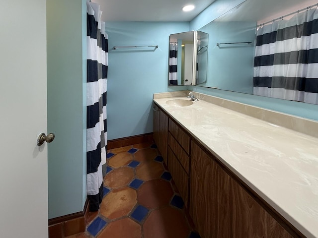 3031 SW Sunset Trace Cir, Palm City, FL 34990 - full bathroom with vanity, baseboards, tile patterned flooring, and a shower with curtain