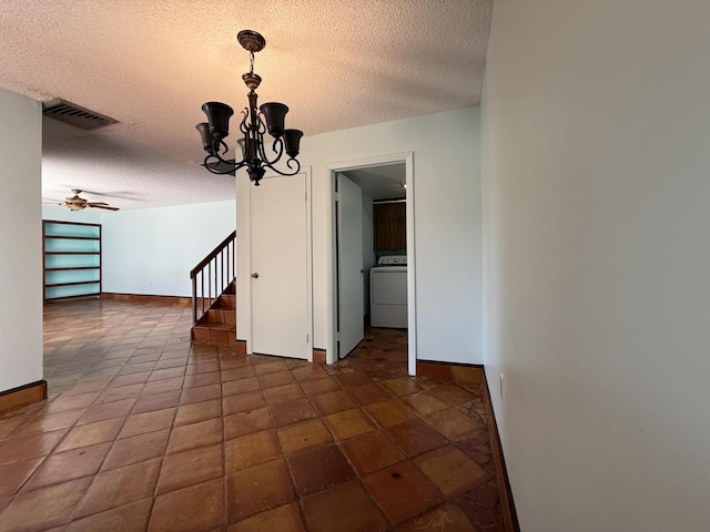 3031 SW Sunset Trace Cir, Palm City, FL 34990 - unfurnished dining area featuring washer / clothes dryer, a textured ceiling, a chandelier, and baseboards