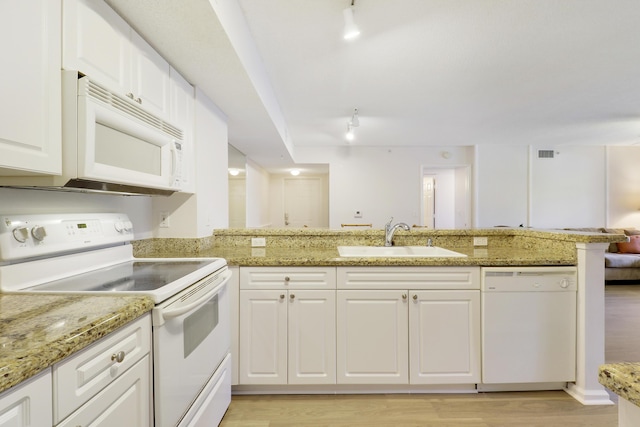 248 Village Blvd Unit 3203, Tequesta, FL 33469 - kitchen featuring white cabinets, track lighting, a sink, white appliances, and visible vents