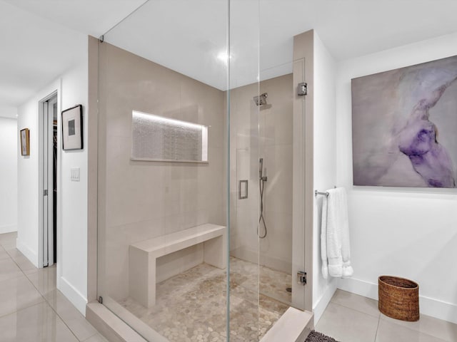 3300 S Ocean Blvd Unit 108S, Palm Beach, FL 33480 - bathroom with tile patterned flooring, a walk in shower, and baseboards
