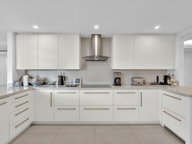 3300 S Ocean Blvd Unit 108S, Palm Beach, FL 33480 - kitchen with wall chimney range hood, light tile patterned flooring, light countertops, black electric cooktop, and modern cabinets