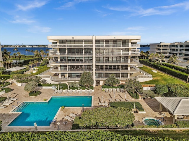 3300 S Ocean Blvd Unit 108S, Palm Beach, FL 33480 - community pool featuring a water view and a patio area
