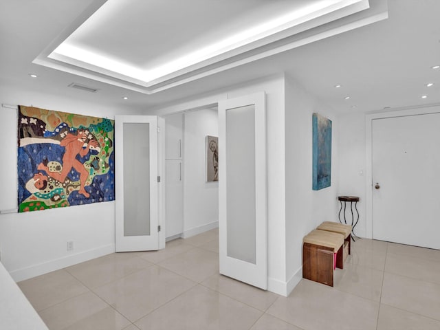 3300 S Ocean Blvd Unit 108S, Palm Beach, FL 33480 - corridor featuring recessed lighting, baseboards, and a tray ceiling