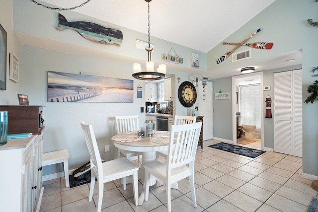 1627 SE Green Acres Cir Unit Z-203, Port Saint Lucie, FL 34952 - dining room featuring high vaulted ceiling, a chandelier, baseboards, light tile patterned floors, and visible vents