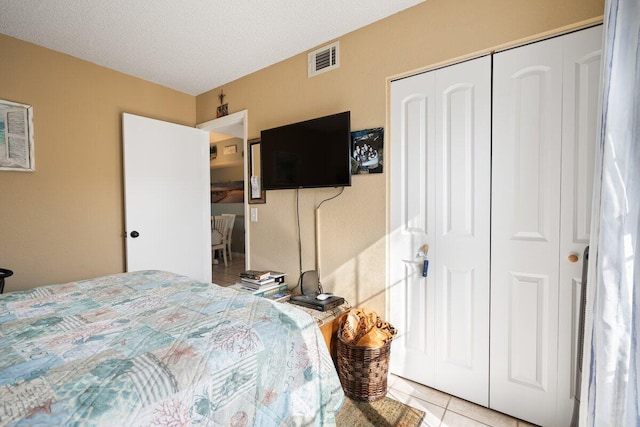 1627 SE Green Acres Cir Unit Z-203, Port Saint Lucie, FL 34952 - tiled bedroom featuring visible vents and a closet
