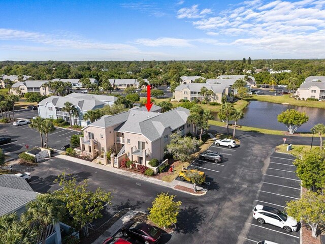 1627 SE Green Acres Cir Unit Z-203, Port Saint Lucie, FL 34952 - bird's eye view with a water view and a residential view