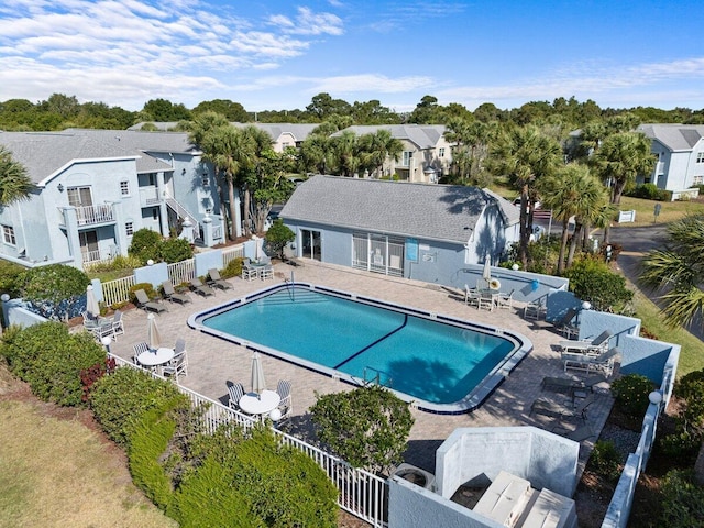1627 SE Green Acres Cir Unit Z-203, Port Saint Lucie, FL 34952 - pool with fence, a patio, and a residential view