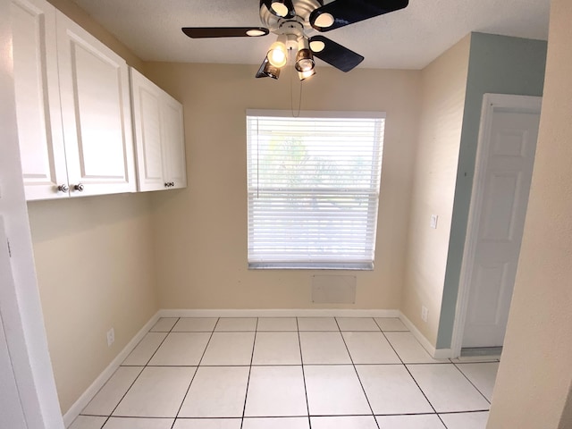 1120 Mahogany Way Unit 203, Delray Beach, FL 33445 - unfurnished dining area with ceiling fan, light tile patterned flooring, and baseboards