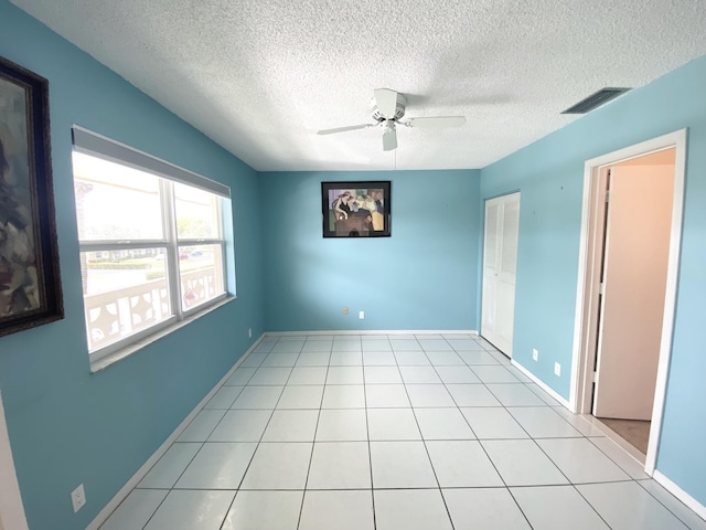 1120 Mahogany Way Unit 203, Delray Beach, FL 33445 - unfurnished room featuring ceiling fan, a textured ceiling, and baseboards