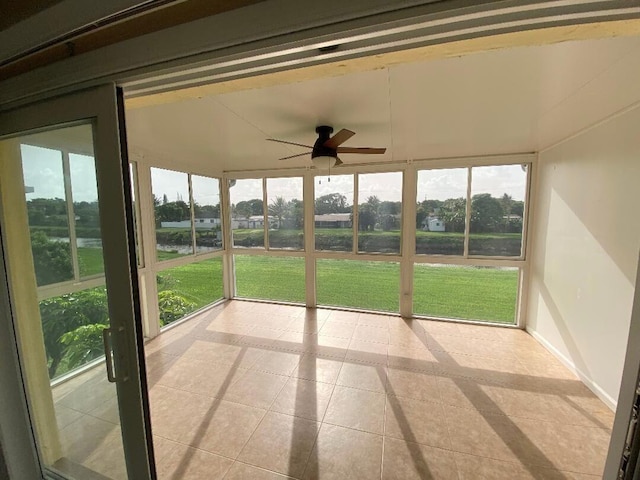 1120 Mahogany Way Unit 203, Delray Beach, FL 33445 - unfurnished sunroom featuring a ceiling fan and plenty of natural light