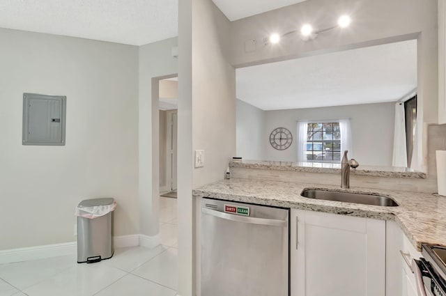 kitchen with electric panel, appliances with stainless steel finishes, a sink, light tile patterned floors, and white cabinetry