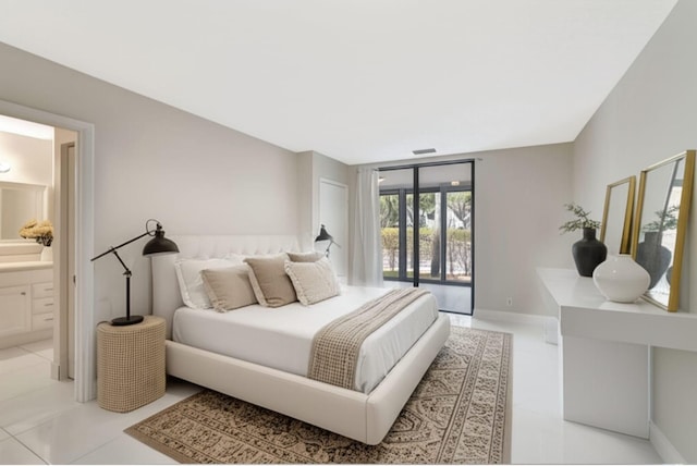 5438 Verona Dr Unit H, Boynton Beach, FL 33437 - bedroom with ensuite bath, tile patterned flooring, and access to exterior