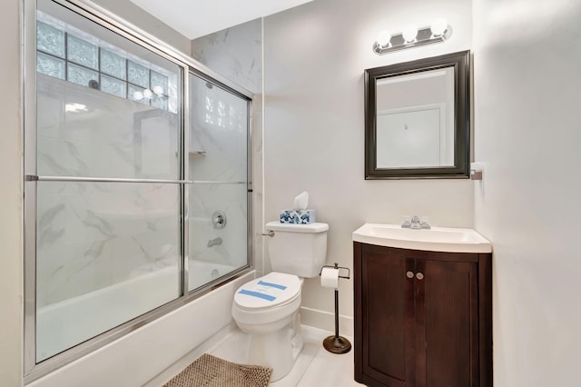 full bath with vanity, baseboards, combined bath / shower with glass door, and toilet