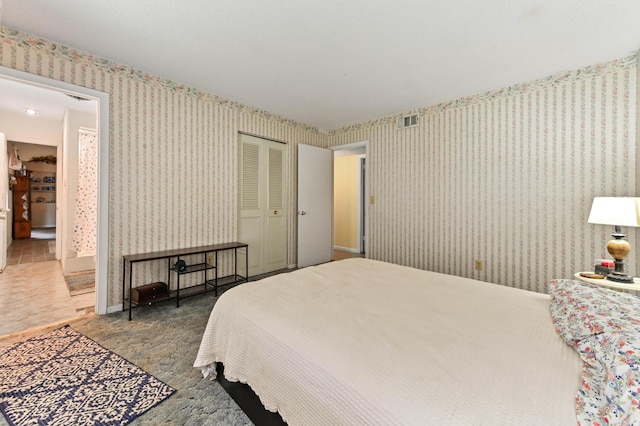 2104 S 26th St, Fort Pierce, FL 34947 - carpeted bedroom featuring wallpapered walls and a closet