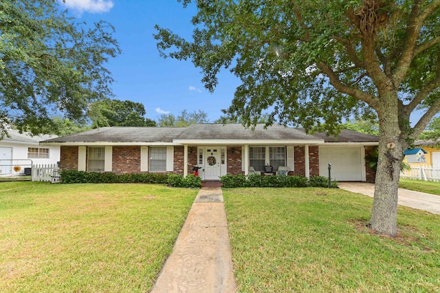 2104 S 26th St, Fort Pierce, FL 34947 - ranch-style home with a garage, concrete driveway, and brick siding