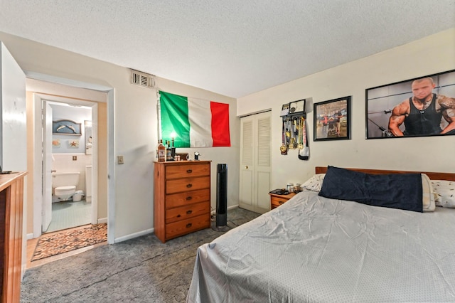 2104 S 26th St, Fort Pierce, FL 34947 - bedroom with a closet, carpet, a textured ceiling, and baseboards