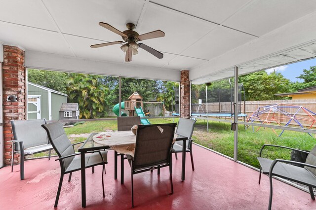 2104 S 26th St, Fort Pierce, FL 34947 - view of patio / terrace featuring a trampoline, outdoor dining space, a playground, and a ceiling fan