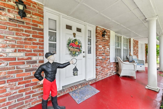 2104 S 26th St, Fort Pierce, FL 34947 - view of exterior entry with covered porch and brick siding