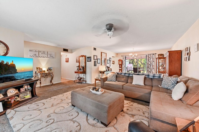 2104 S 26th St, Fort Pierce, FL 34947 - carpeted living room featuring a chandelier, a ceiling fan, and baseboards