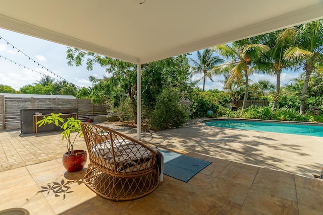 view of patio with a fenced backyard and an outdoor pool
