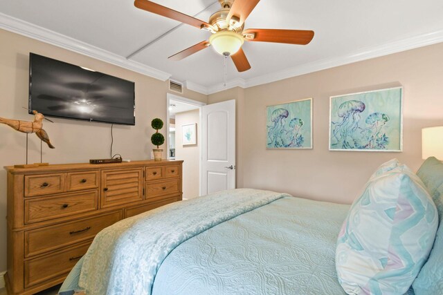 bedroom with a ceiling fan, visible vents, and ornamental molding