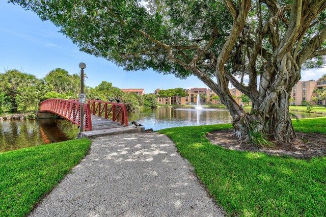 view of community with a water view