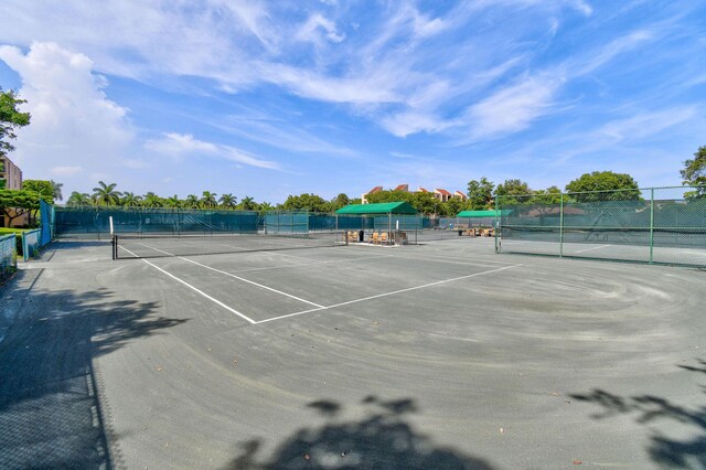 view of sport court with fence