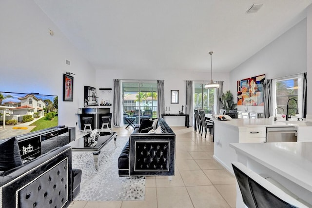 7669 Springwater Pl Unit 202, Boynton Beach, FL 33437 - living area featuring light tile patterned flooring, high vaulted ceiling, and visible vents
