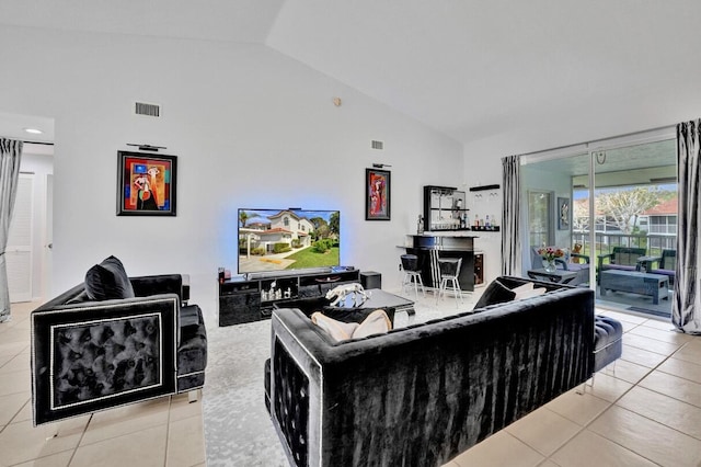 7669 Springwater Pl Unit 202, Boynton Beach, FL 33437 - living area with high vaulted ceiling, visible vents, and tile patterned floors