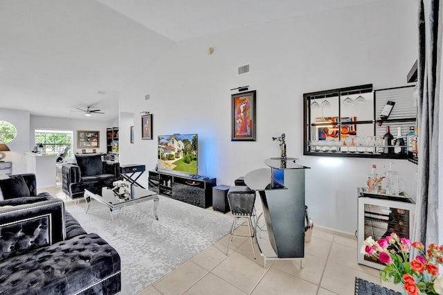 7669 Springwater Pl Unit 202, Boynton Beach, FL 33437 - tiled living room with beverage cooler, a ceiling fan, lofted ceiling, and visible vents