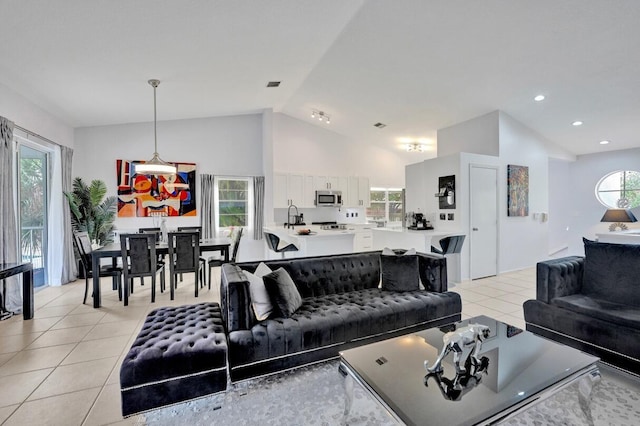 7669 Springwater Pl Unit 202, Boynton Beach, FL 33437 - living area featuring visible vents, recessed lighting, light tile patterned floors, and high vaulted ceiling
