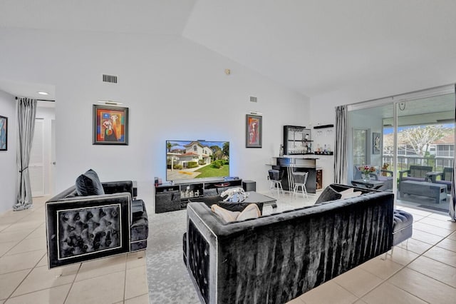 7669 Springwater Pl Unit 202, Boynton Beach, FL 33437 - living area with light tile patterned flooring, high vaulted ceiling, and visible vents