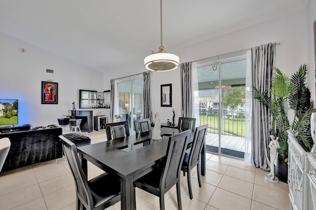 7669 Springwater Pl Unit 202, Boynton Beach, FL 33437 - dining space with visible vents, light tile patterned floors, and lofted ceiling