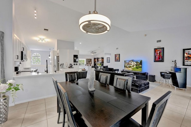 7669 Springwater Pl Unit 202, Boynton Beach, FL 33437 - dining space with lofted ceiling, light tile patterned flooring, and a ceiling fan